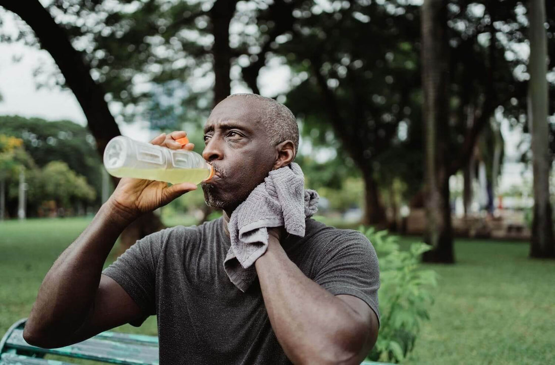 man-drinking-electrolyte-drink